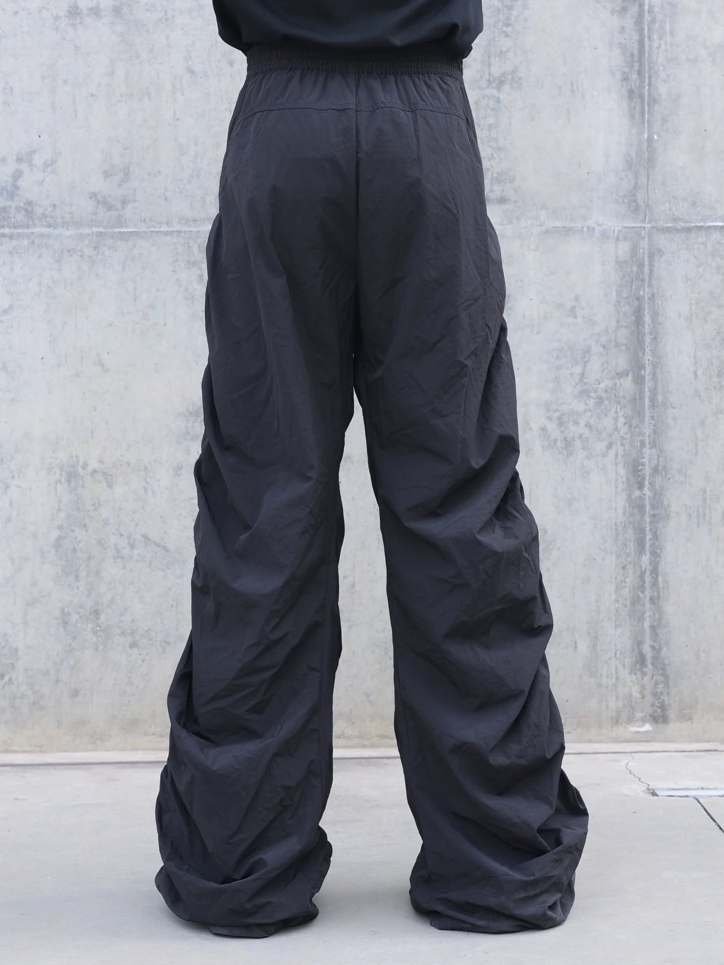 PLEATED SPIRAL CUT PANTS