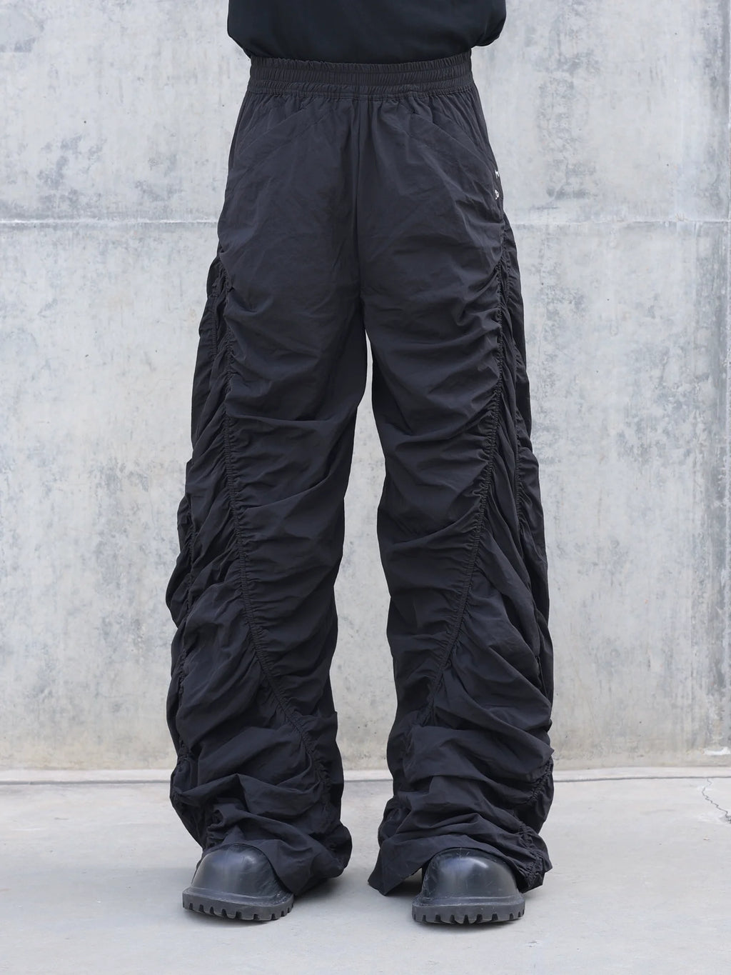 PLEATED SPIRAL CUT PANTS