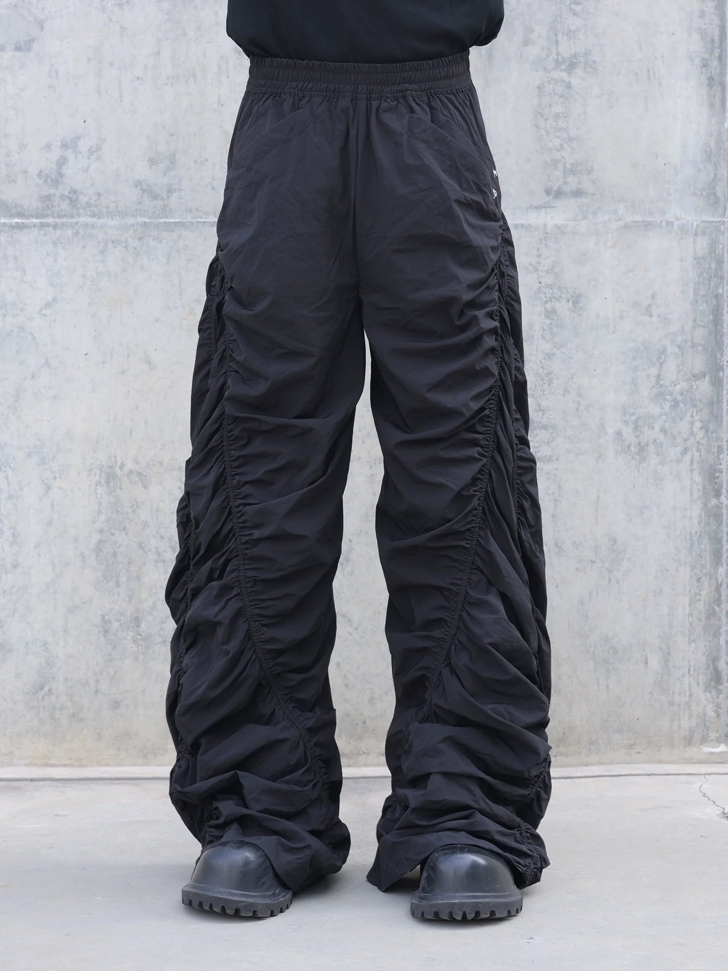 PLEATED SPIRAL CUT PANTS